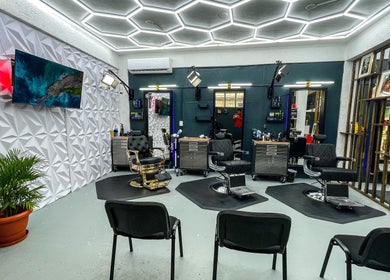 Modern salon interior at Fresh Again Self Care Studio, The Valley, AI with stylish decor and seating.