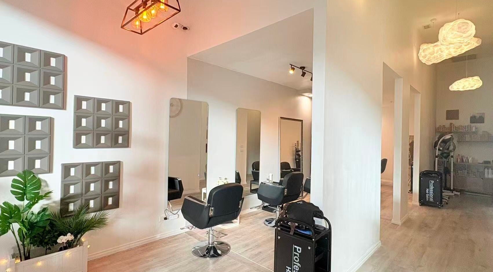 Modern interior of hxhair salon Beauty and Nails in Melbourne, Victoria, AU, featuring sleek design and styling chairs.