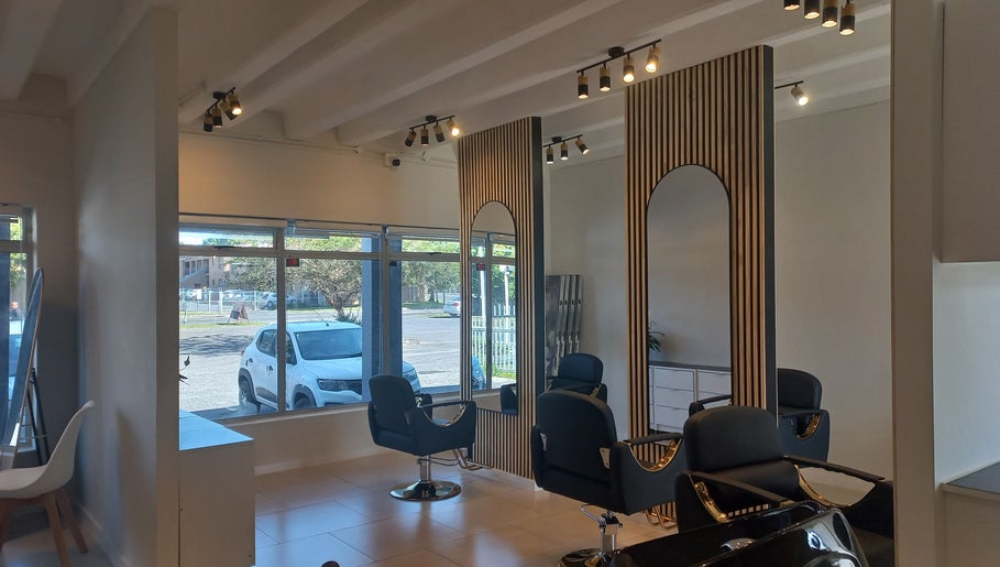 Elegant interior of Opalé Beauty Studio in Cape Town, Western Cape, ZA featuring sleek salon chairs and modern decor.