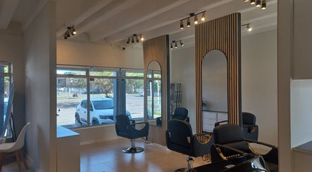 Elegant interior of Opalé Beauty Studio in Cape Town, Western Cape, ZA featuring sleek salon chairs and modern decor.