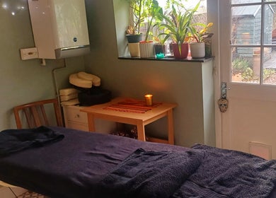 Tranquil massage room at MaxRelax Massage Therapy, London, England, GB with a table and soothing decor.