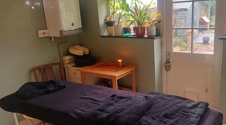 Tranquil massage room at MaxRelax Massage Therapy, London, England, GB with a table and soothing decor.