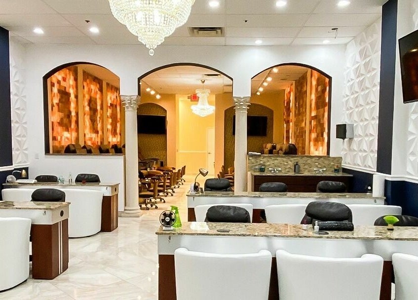 Elegant interior of Himalayan Nails and Spa in Royal Palm Beach, Florida, US with luxurious decor and seating.