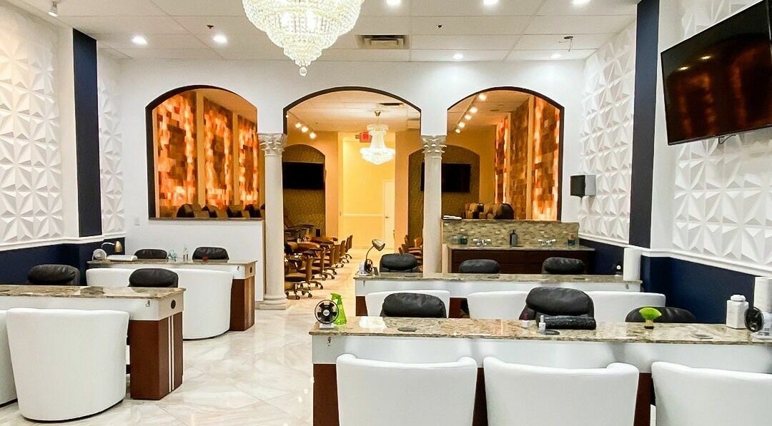 Elegant interior of Himalayan Nails and Spa in Royal Palm Beach, Florida, US with luxurious decor and seating.