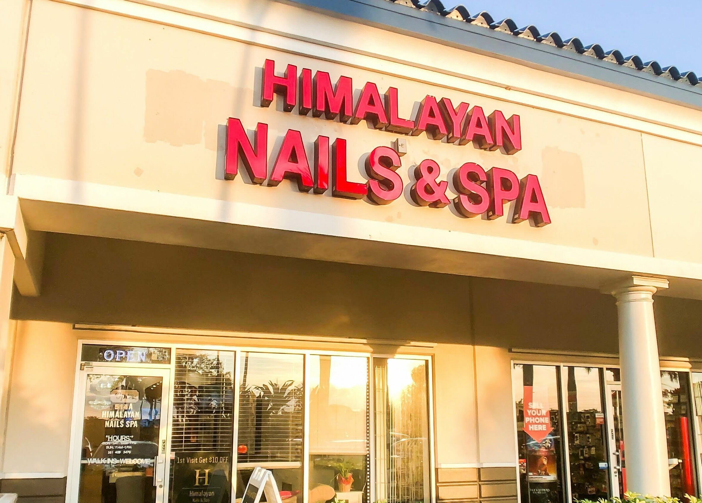 Front of Himalayan Nails and Spa at sunrise in Royal Palm Beach, Florida. Welcoming atmosphere and modern design.