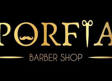 Logotipo dourado da Porfia BarberShop em Guimarães, Braga, PT, destacando tesoura e bigode.