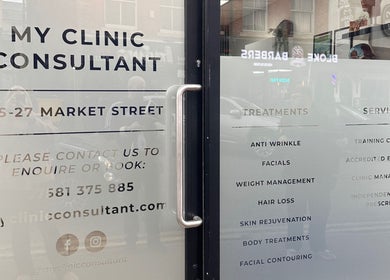 Entrance glass door of My Clinic Consultant, located at 25-27 Market Street, Chorley, England, GB.