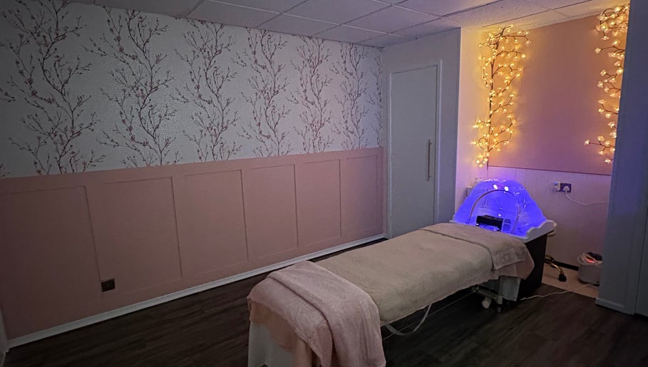 Relaxing massage room at Cherry Blossom Spa in Leyland, England, GB, featuring calming floral decor and soft lighting.