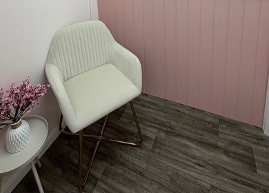 Elegant chair and blossoms in Cherry Blossom Spa, Leyland, England, GB, creating a calm, inviting atmosphere.