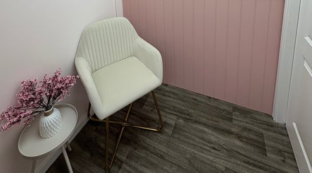 Elegant chair and blossoms in Cherry Blossom Spa, Leyland, England, GB, creating a calm, inviting atmosphere.