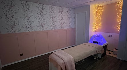 Tranquil massage room at Cherry Blossom Spa, Leyland, England, GB, with soft lighting and calming decor.
