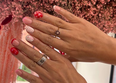 Stylish nail art from Gels By Em - The Ladies Room Lytham, Lytham Saint Annes, England, GB with floral backdrop.