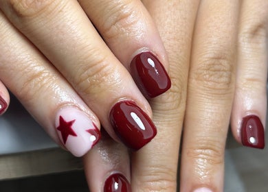 Elegant red and star nail design at Gels By Em - The Ladies Room Lytham, Lytham Saint Annes, England, GB.
