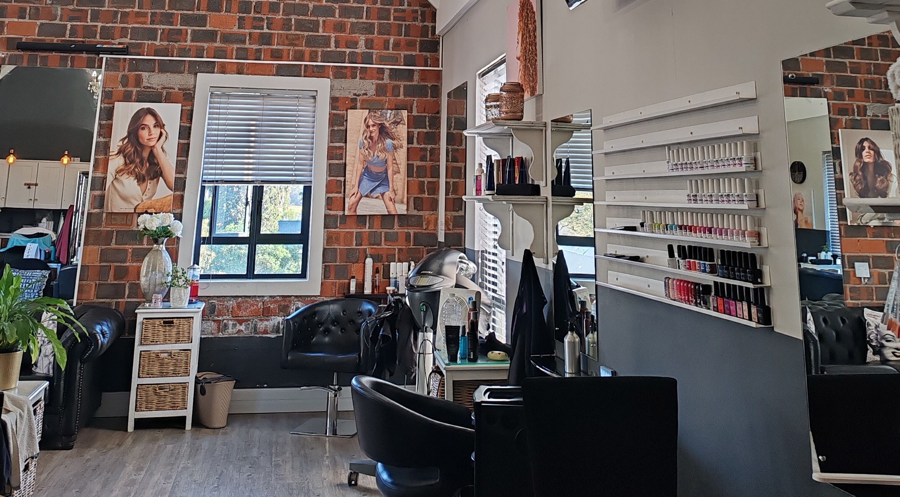 Cozy interior of Hair by Tess in Cape Town, Western Cape, ZA featuring stylish chairs and beauty products.