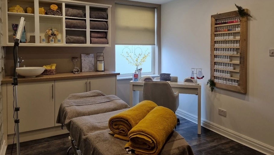 Relaxing interior of Helow Beauty Blackpool featuring treatment beds and cozy towels in Blackpool, England, GB.