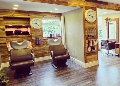 Warm, inviting salon chairs at Helow Beauty Blackpool, Blackpool, England, GB, showcasing its rustic decor.