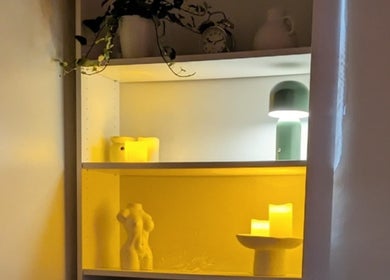 Elegant shelf decor at Chioma Beauty and Bodywork, London, England, GB, featuring soothing candles and gentle lighting.