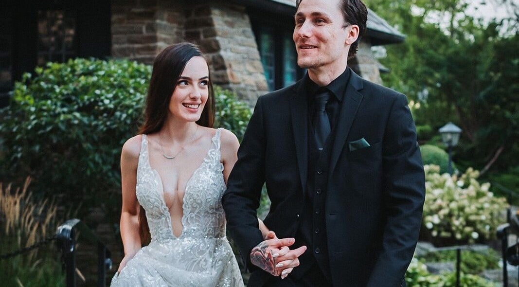 A couple in formal attire outside a venue styled by Toni Rose Makeup Artist & Hairstyling Services, Toronto, Ontario, CA.