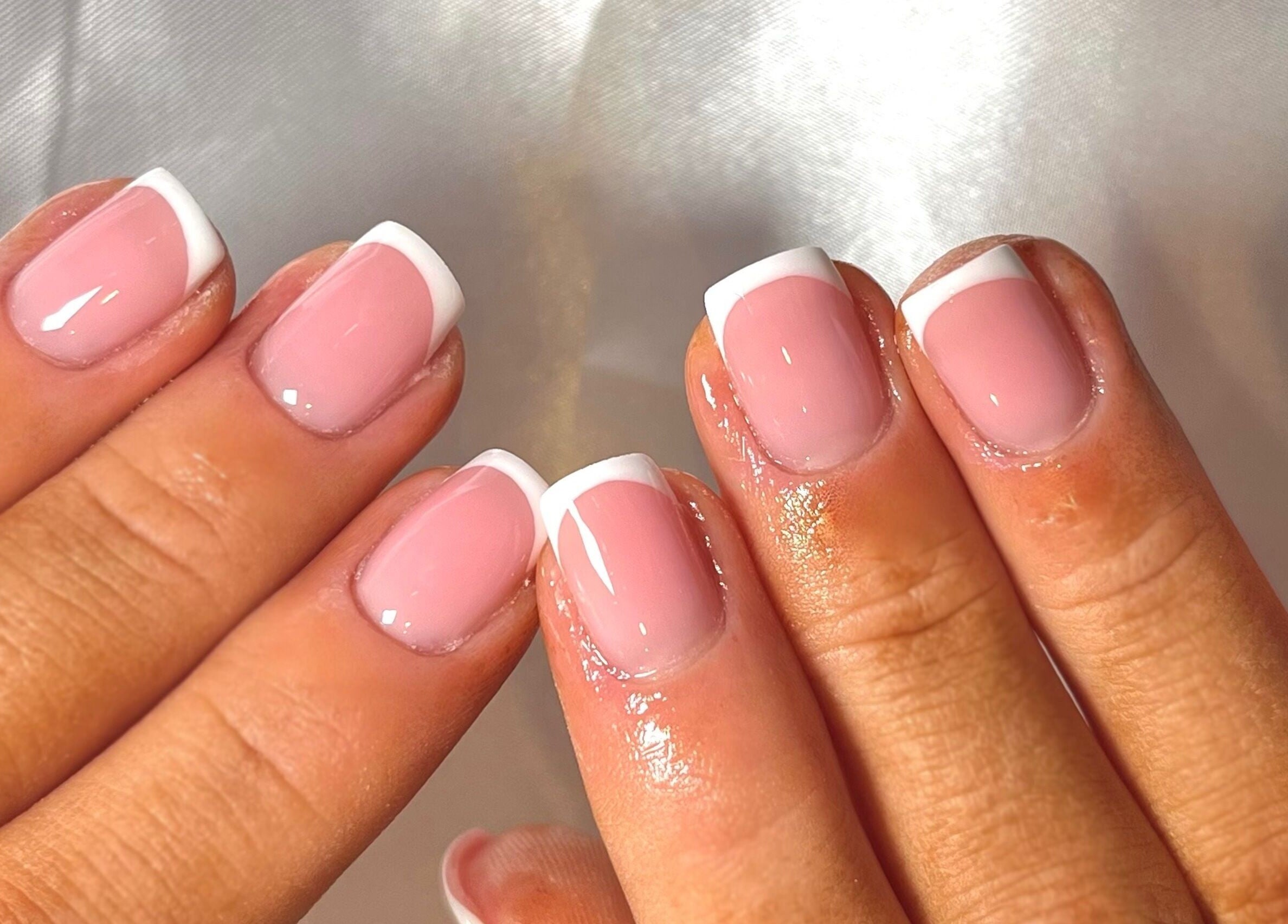 Chic French manicure at Nails by Ray, Chelmsford, England, GB. Perfectly polished pink nails with white tips.