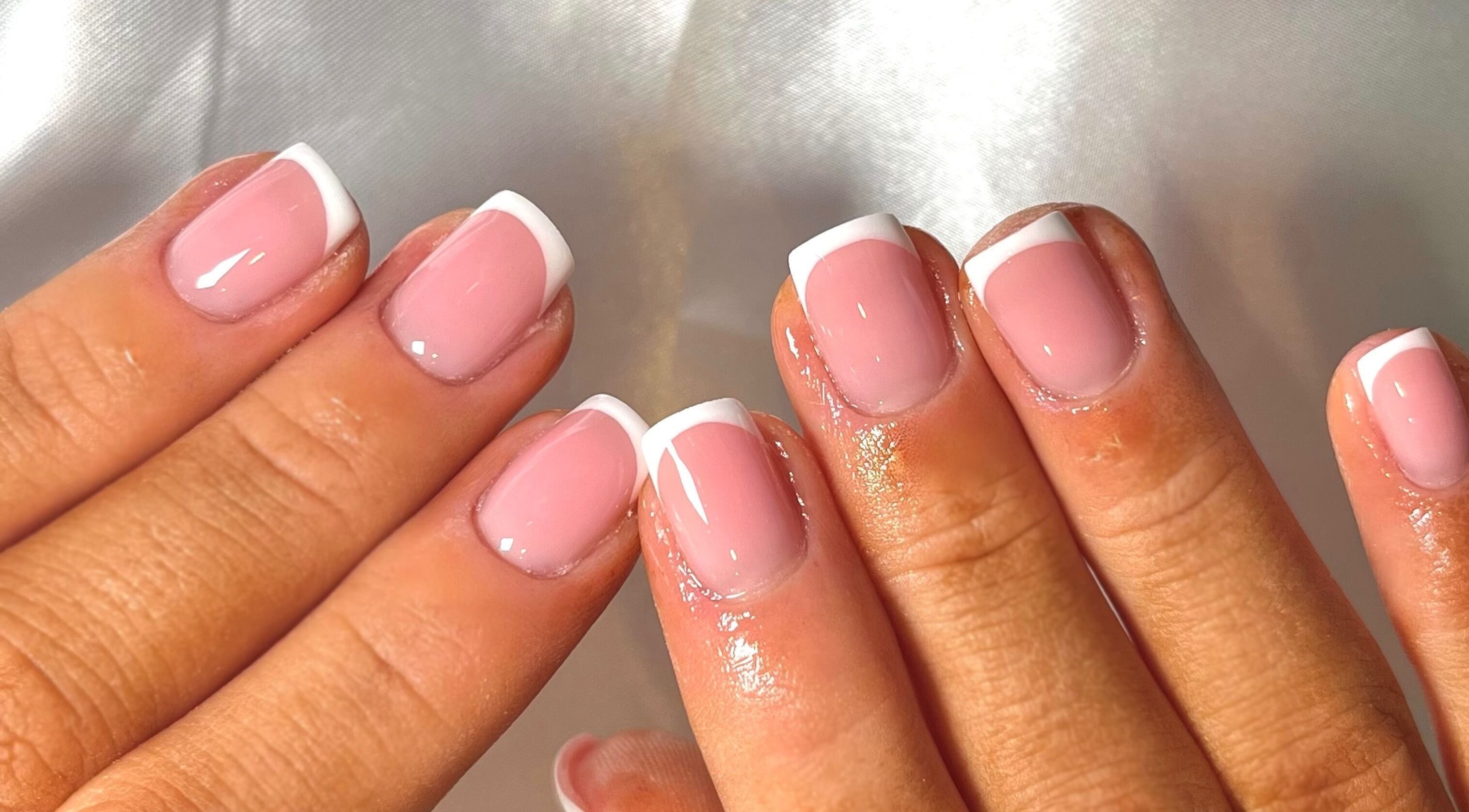 Chic French manicure at Nails by Ray, Chelmsford, England, GB. Perfectly polished pink nails with white tips.