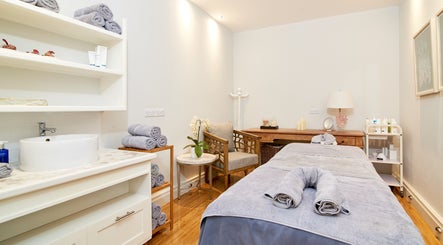 Relaxing treatment room at The Spa at Calabash, Saint George's, Saint George, GD, featuring a cozy massage table.
