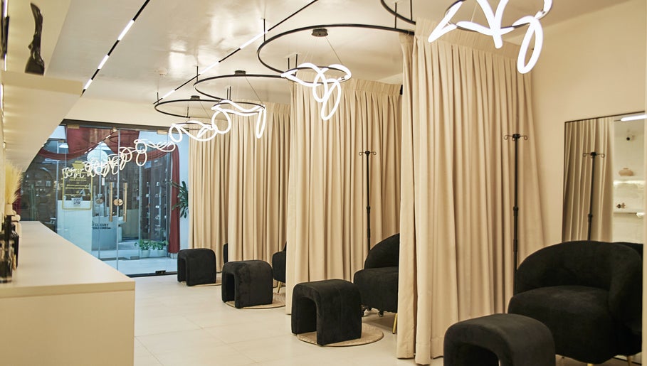 Chic seating area at IVVI, Lekki, Lagos, NG with modern lighting and neutral decor.