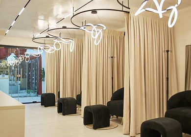 Chic seating area at IVVI, Lekki, Lagos, NG with modern lighting and neutral decor.