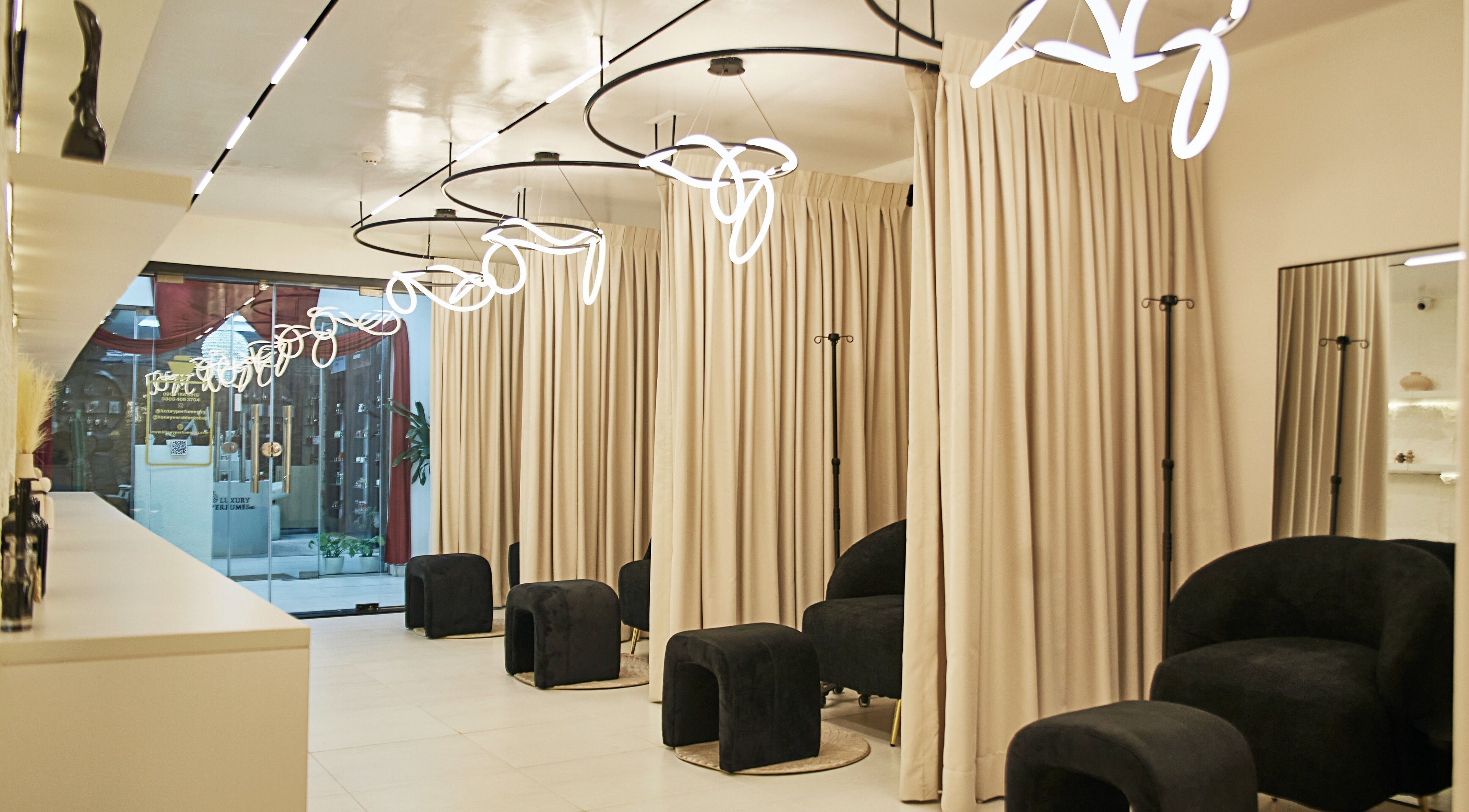 Chic seating area at IVVI, Lekki, Lagos, NG with modern lighting and neutral decor.