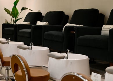Luxurious pedicure chairs at REE SPA - TRIBECA, New York, New York, US with elegant decor.