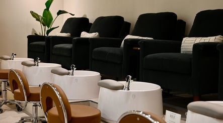 Luxurious pedicure chairs at REE SPA - TRIBECA, New York, New York, US with elegant decor.