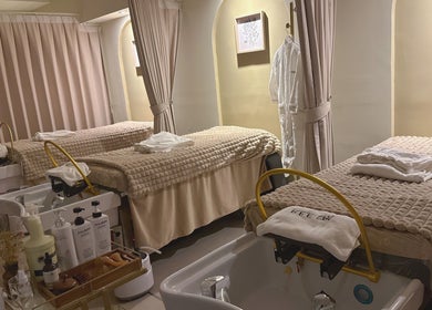 REE SPA treatment room with beds and robes in New York, New York, US, offering ultimate relaxation.