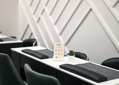 REE SPA nail salon setup in New York, New York with elegant manicure stations and sleek modern design.