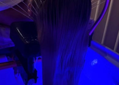 Calming hair rinse at REE SPA in New York, New York, US under soothing blue light.