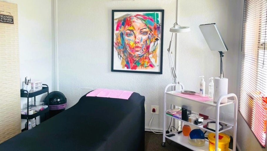 Colorful treatment room at OCD Permanent MakeUp, Krugersdorp, Gauteng, ZA with art and supplies.