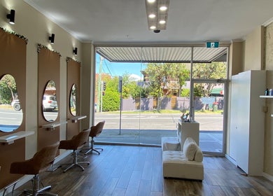 Chic interior of Hairbyloisbodie, Randwick, New South Wales, AU, featuring stylish salon chairs and mirrors.