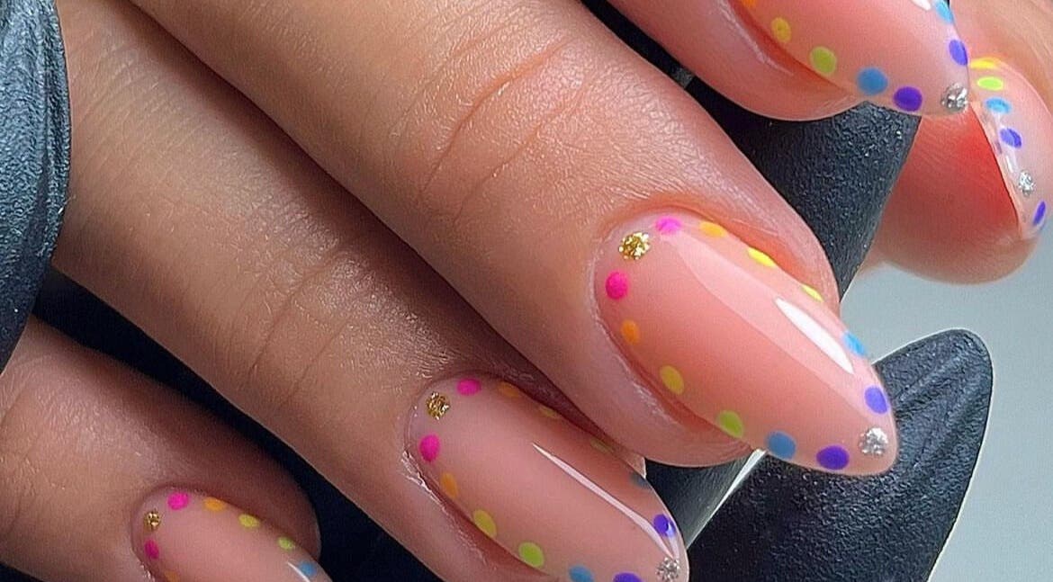 Vibrant nail art with colorful dots at BB, GB enhancing elegant nail style.