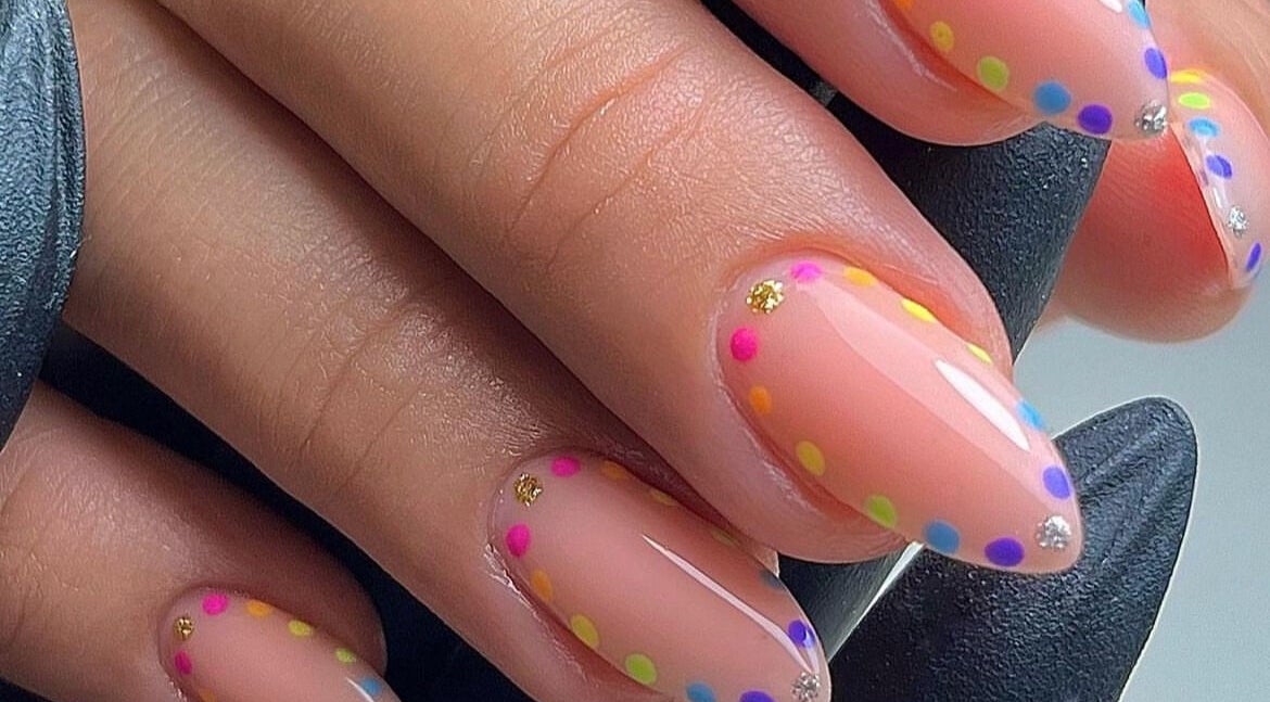 Vibrant nail art with colorful dots at BB, GB enhancing elegant nail style.