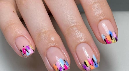 Vibrant rainbow nail art at BB, GB showing colorful designs on manicured nails.