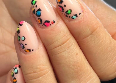 Colorful leopard nail design at BB in GB, showcasing vibrant and trendy nail art.