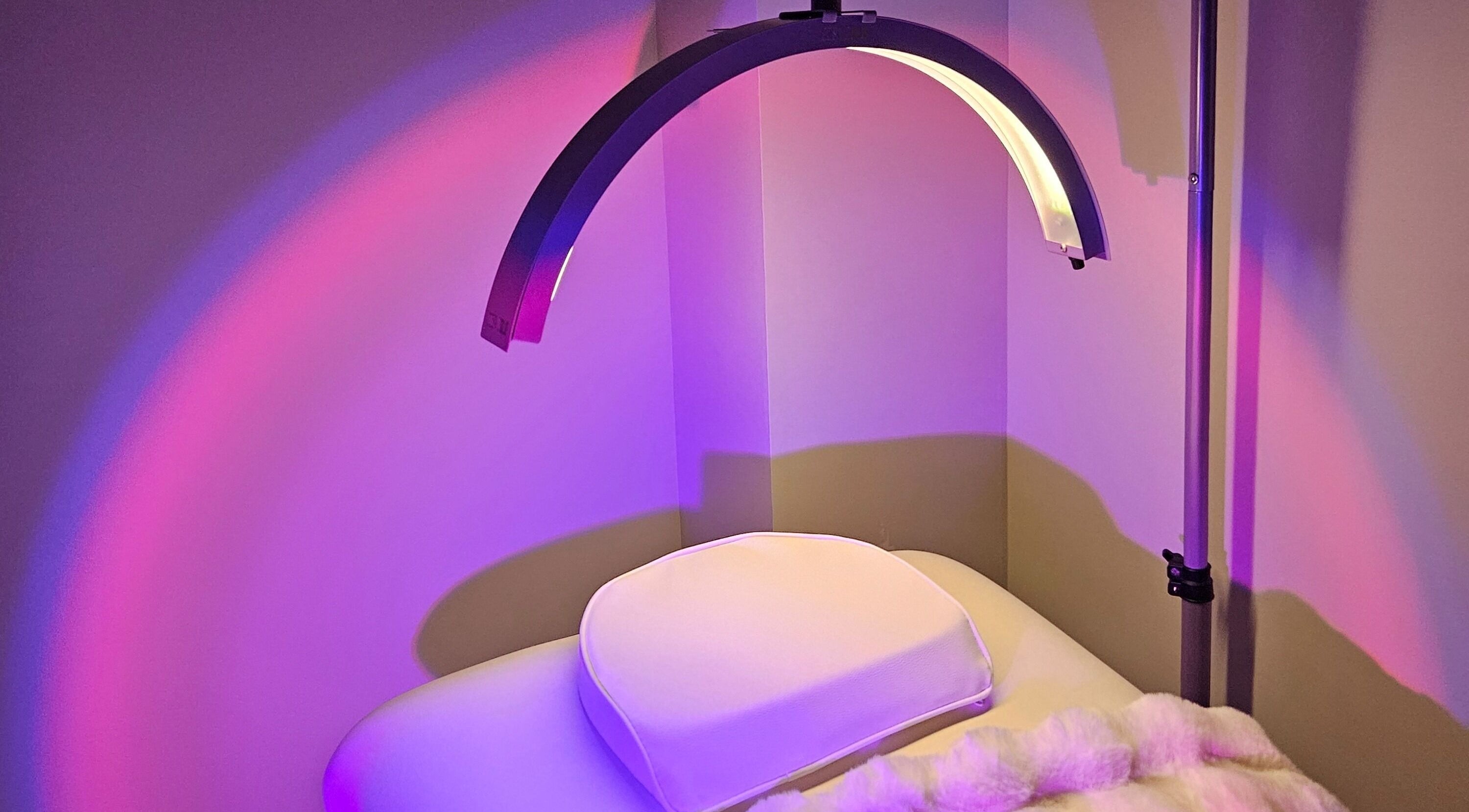 Tranquil LED light therapy room at Beauty Genie, Mill Creek, Washington, US with calming purple hues.