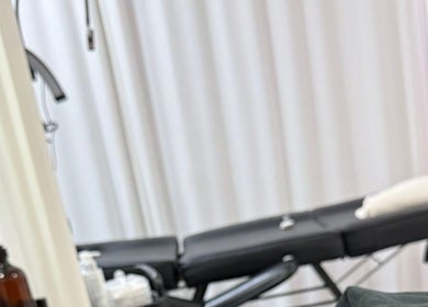 Relaxing spa treatment room at Bodyaidbham, Birmingham, England, GB with massage table and soft lighting.