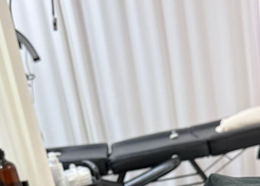 Relaxing spa treatment room at Bodyaidbham, Birmingham, England, GB with massage table and soft lighting.