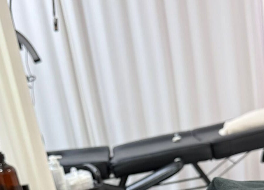 Relaxing spa treatment room at Bodyaidbham, Birmingham, England, GB with massage table and soft lighting.