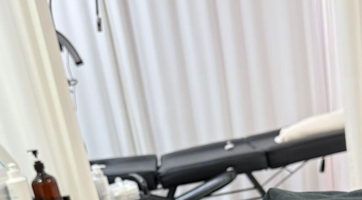 Relaxing spa treatment room at Bodyaidbham, Birmingham, England, GB with massage table and soft lighting.