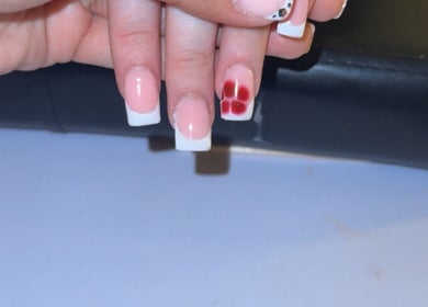 Elegant nail art featuring a flower design at Glosseditbychelsie, Clitheroe, England, GB.