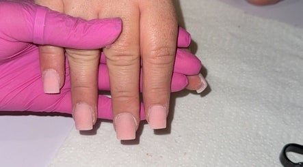Expert nail treatment at Glosseditbychelsie, Clitheroe, England, GB. Pink gloves, elegant pink nails.