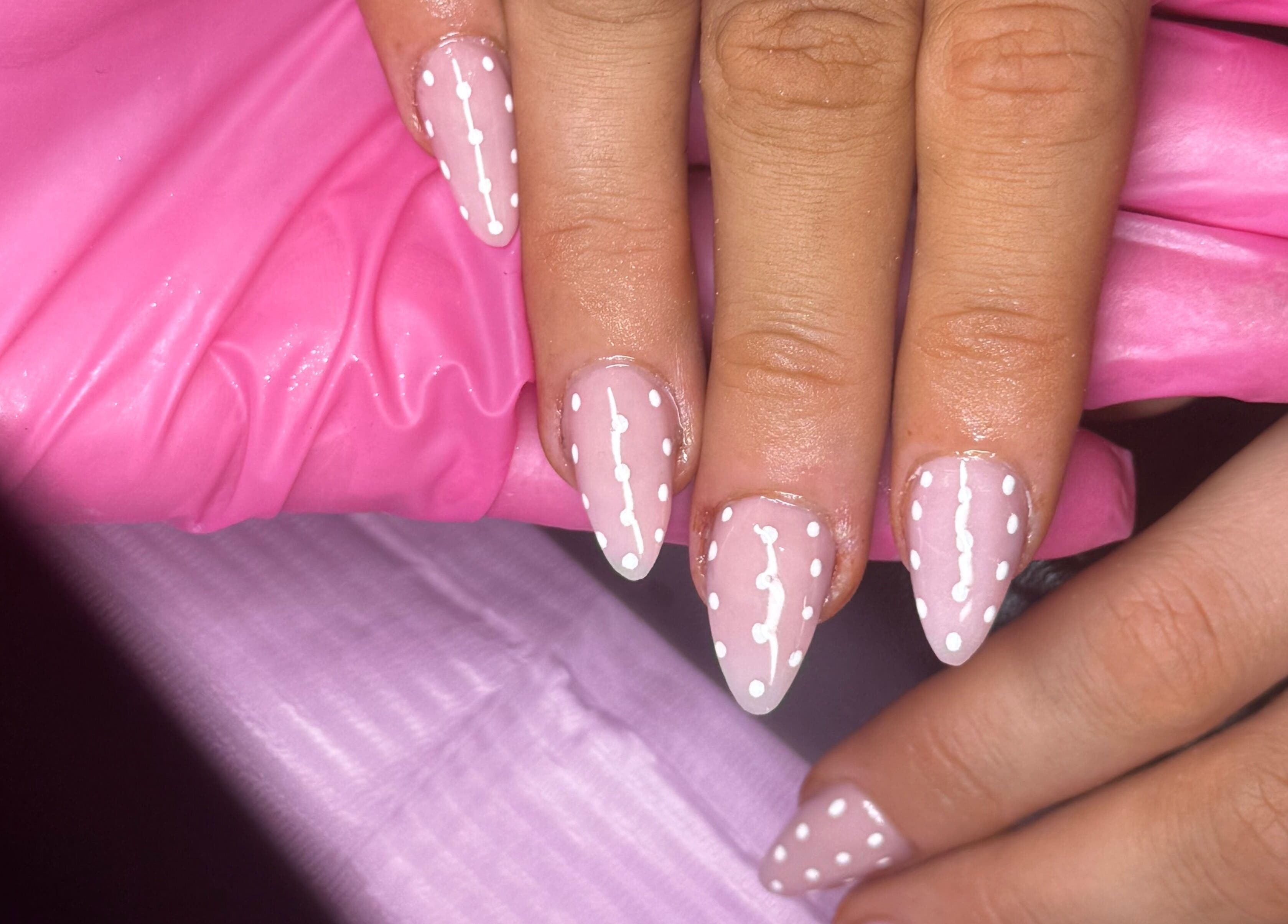Chic pink and white polka dot nail art at Glosseditbychelsie, Clitheroe, England, GB.