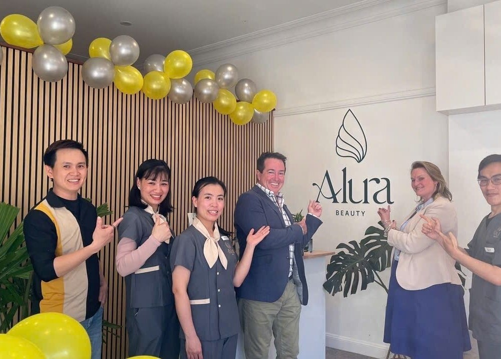 Team smiling at Alura Beauty Lithgow, located in Lithgow, New South Wales, AU with festive decor.
