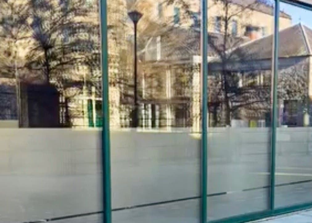 Exterior of Revive Hair And Beauty Studio in Aberdeen, Scotland, GB with glass facade reflecting surroundings.