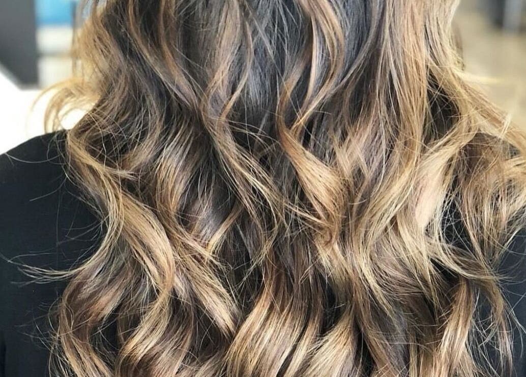 Close-up of golden wavy hair styled at Glaze Studios, Oxnard, California, US.
